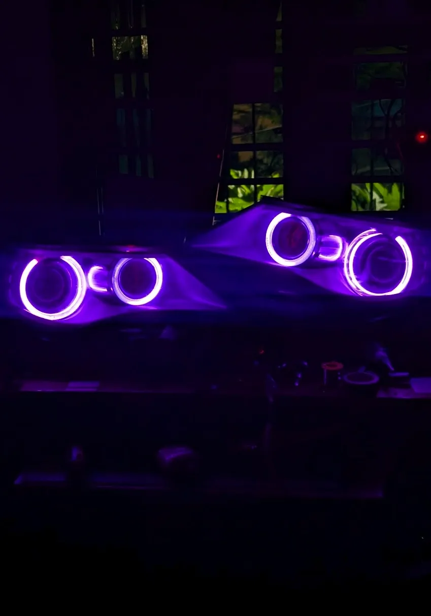 Custom purple LED angel eye headlights for BMW halo ring modification