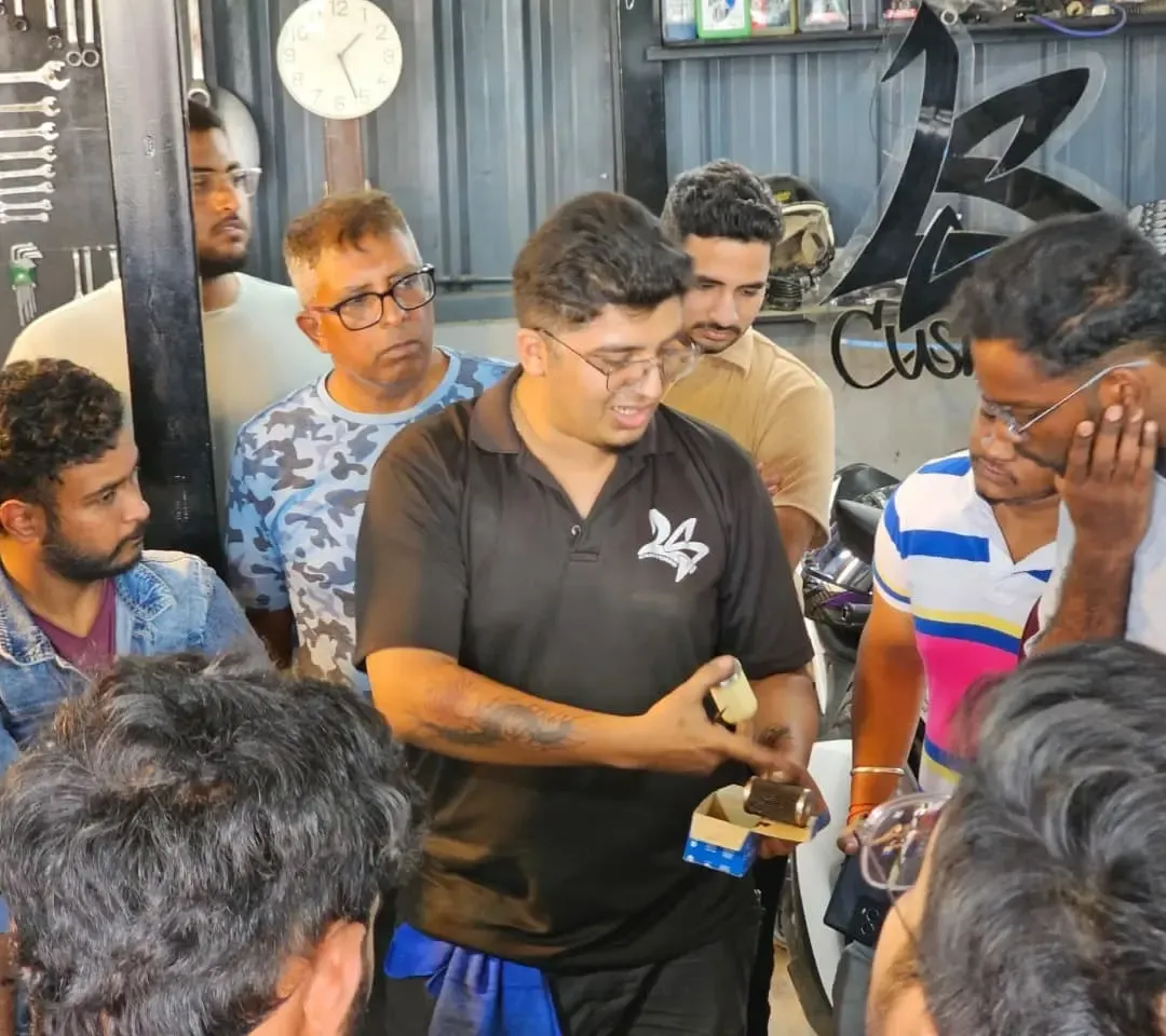 Group motorcycle maintenance session at LS Customs